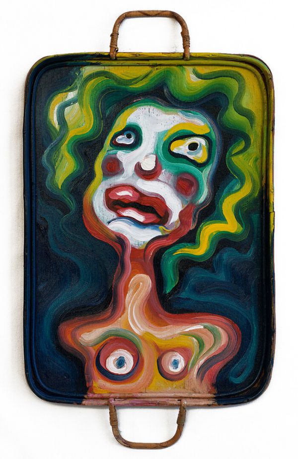Amputee clown painted on a wooden platter